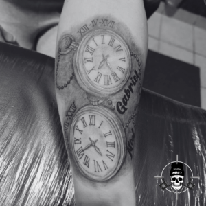 Clocks With Birth Date/Time Under Sleeve Tattoo