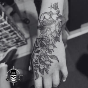 roses on hand tattoo